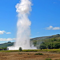 Strokkur erupts while Tove watches