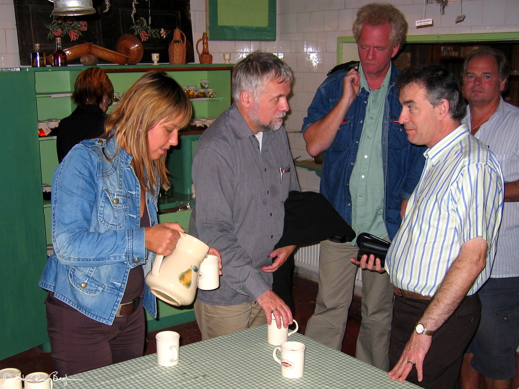Ursa pouring tea for attentive Martin and slightly absent looking Geir and Torbjørn