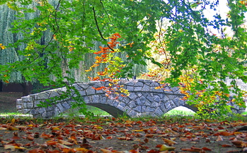 Autumn colors and bridge in pond by Trebnik Castle 