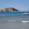 The citadel and a water jet as seen from Calvi beach