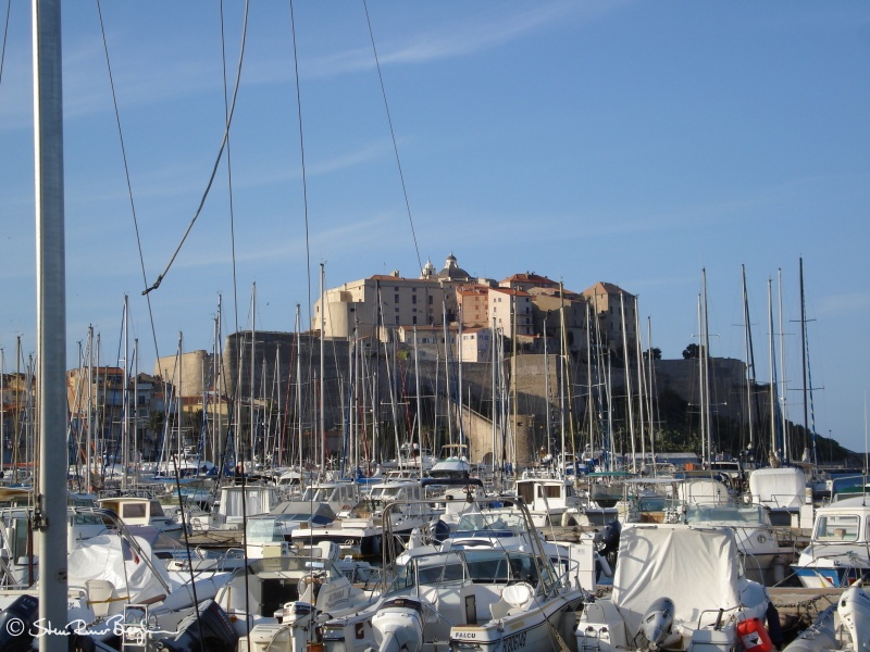 Sail boat masts in front of the citadel in Calvi