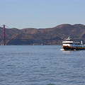Bay cruiser passing in front of the Golden Gate bridge
