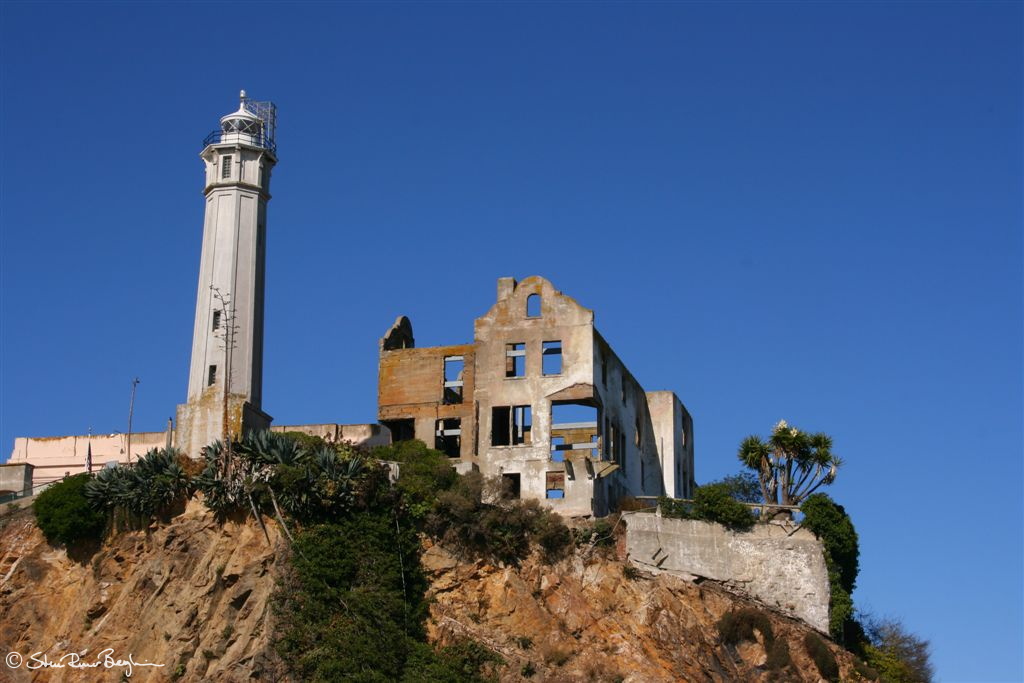 Light house and fallen-down prison-warden's building
