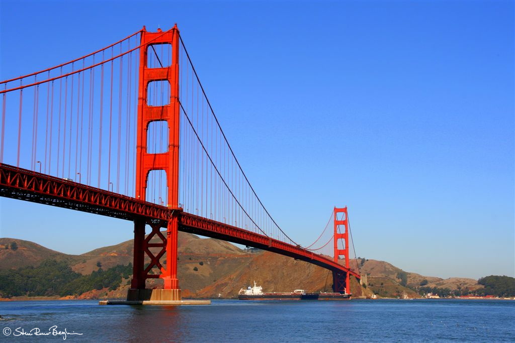 Tanker vessel passing under the Golden Gate bridge