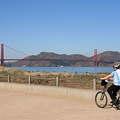 Idar cycling on beach below Golden Gate bridge