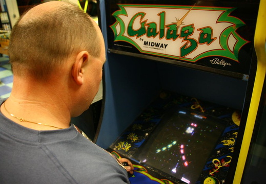 Idar playing Galaga at Santa Monica Pier arcade