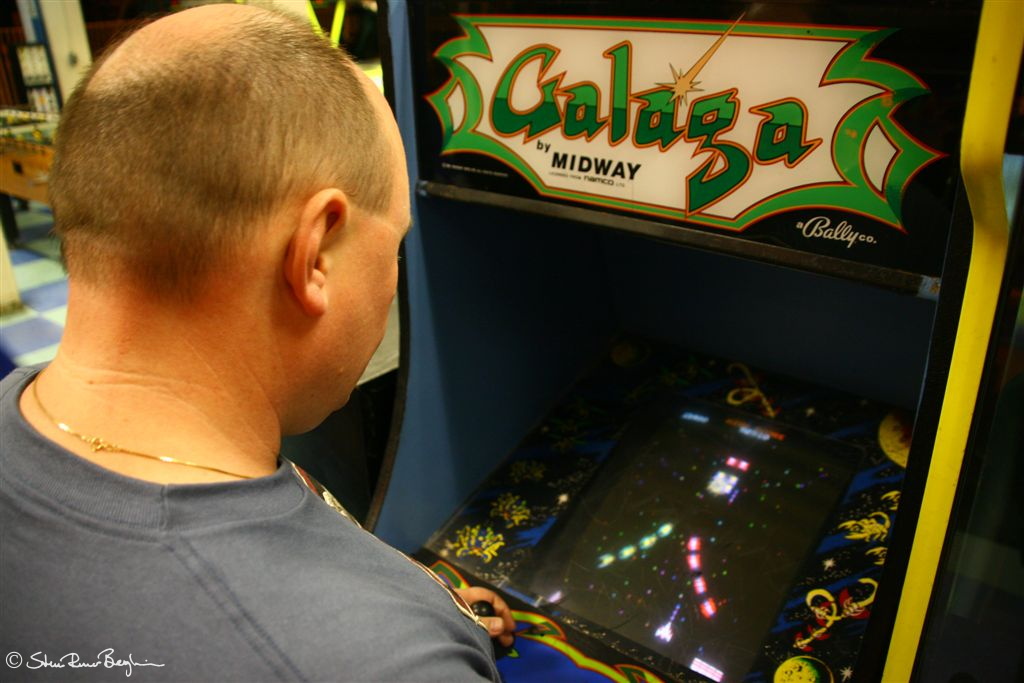 Idar playing Galaga at Santa Monica Pier arcade