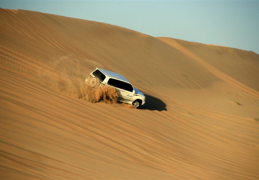 Land Cruiser sliding down sand dune