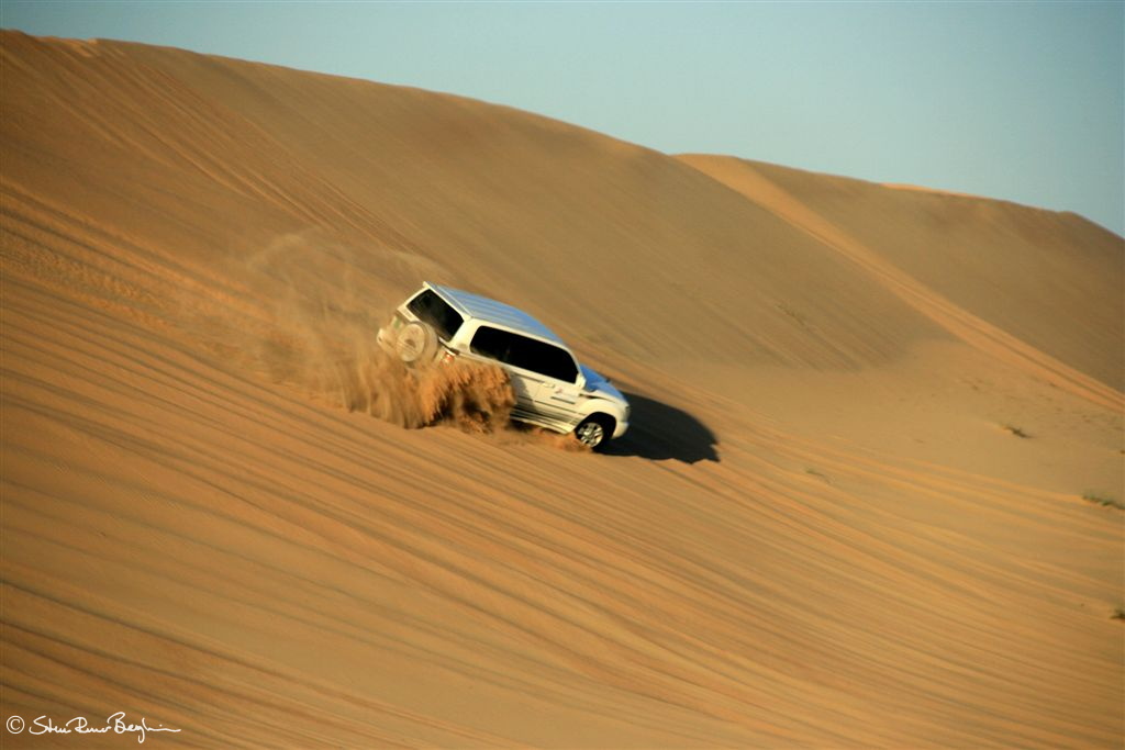 Land Cruiser sliding down sand dune