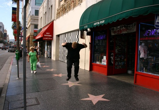 Runar stomping on Liberace's star on Hollywood Walk of Fame