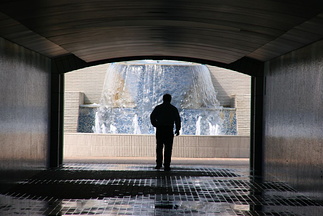 Man walking through pedestrian underpass at the Corniche