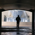 Man walking through pedestrian underpass at the Corniche