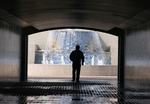 Man walking through pedestrian underpass at the Corniche