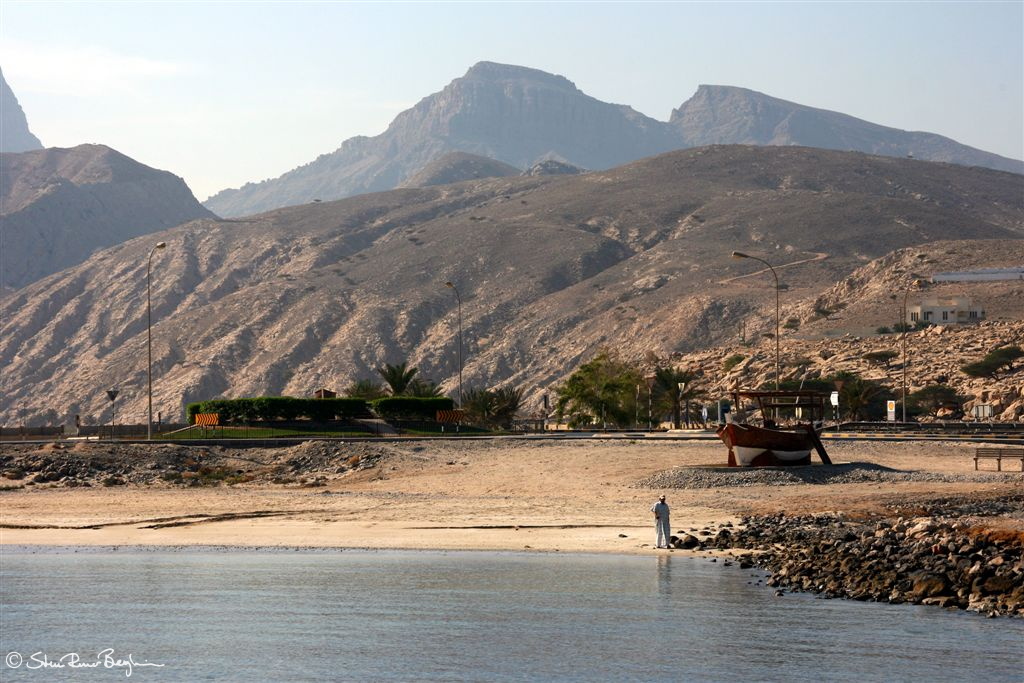Guy walking on the beach