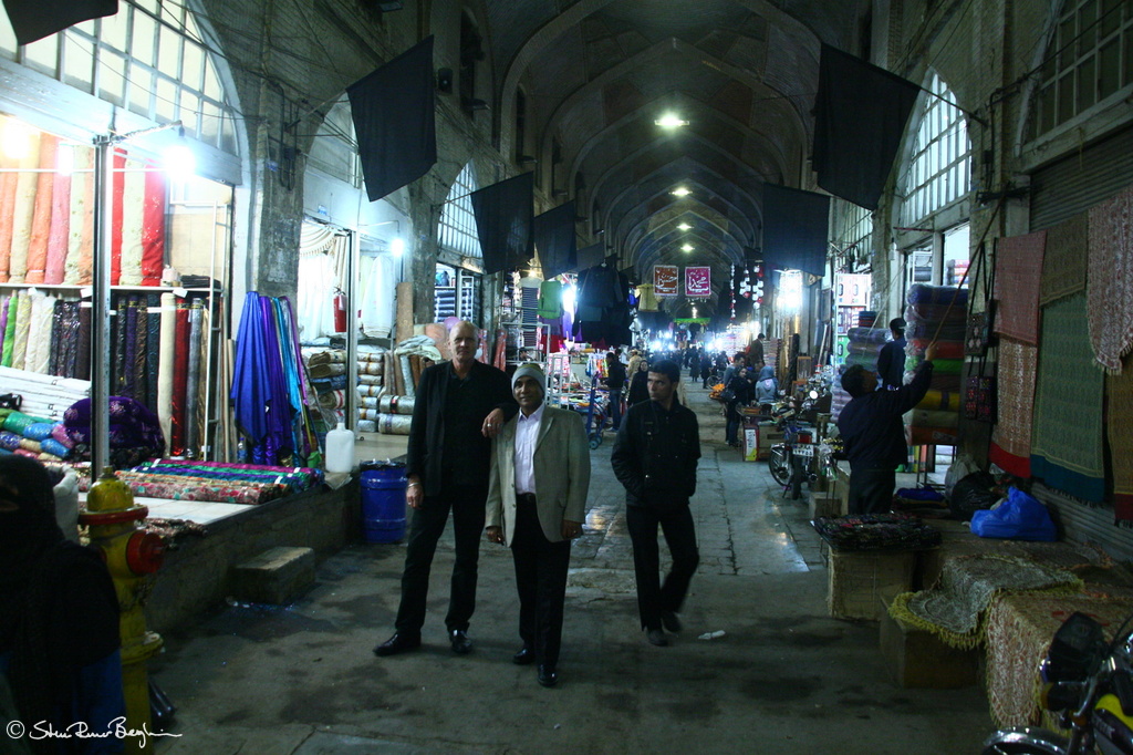Two posing and one looking in Vakil Bazaar