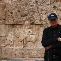 VIF member in front of rock carvings