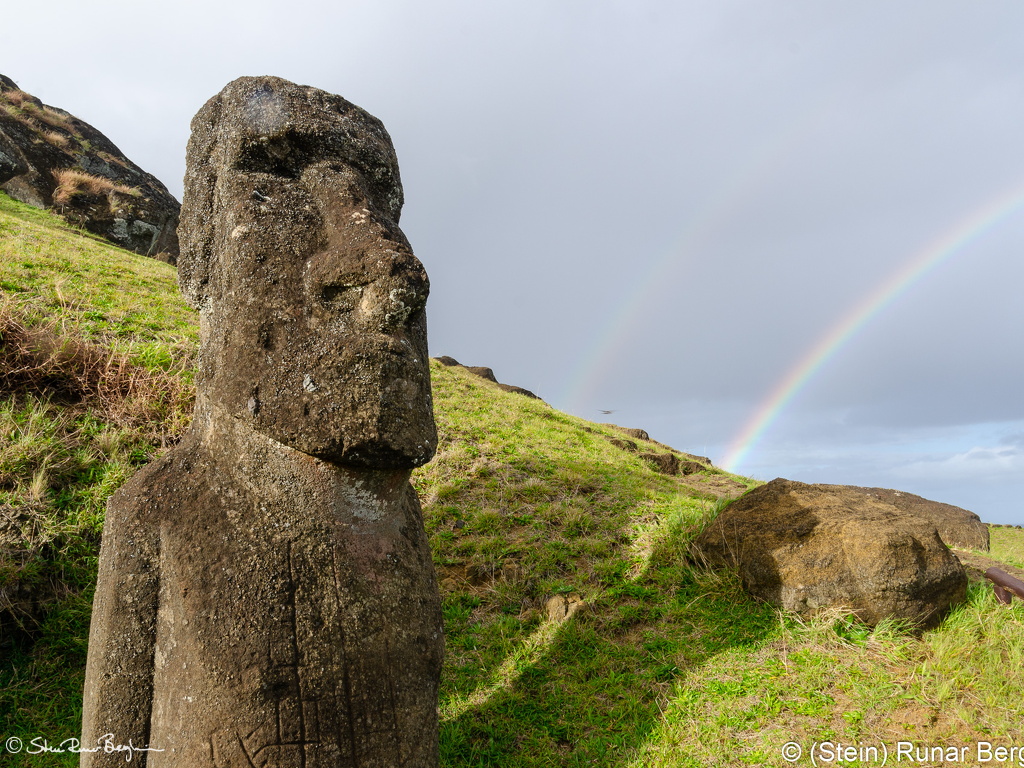 Rainbow by Moai on the southern slope of Rano Raraku